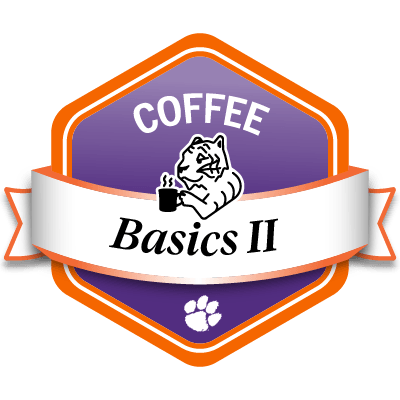 Line drawing of a tiger holding a steaming hot cup of coffee.