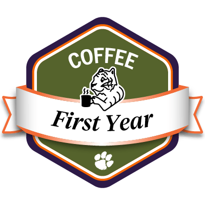 Sample green COFFEE First Year badge featuring a tiger drinking coffee.