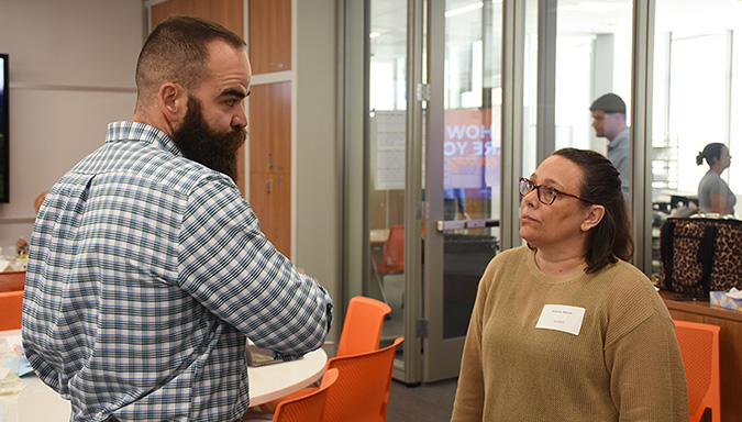 Faculty members in conversation.