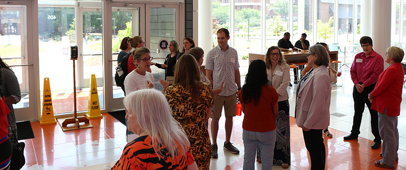 Faculty at watt center gathering.