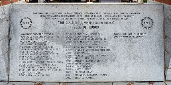 A stone plaque listing the names of distinguished members and recipients of the "Class of '39 Award for Excellence" at Clemson University, highlighting their contributions to the student body and the community.