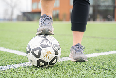 Ashley Schmidt with Soccer Ball at Champions Field, Snow Family Outdoor Activities and Wellness Center