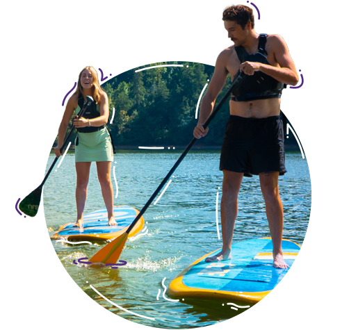 Students Paddle boarding at Snow Family Outdoor Activities and Wellness Complex