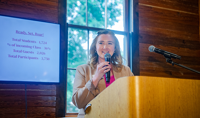 A Student Affairs staff member speaks during a student awards ceremony