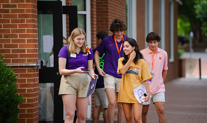 Orientation ambassadors interacting with a group of students