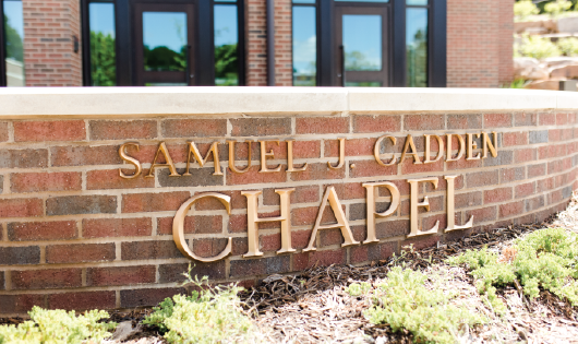 Brick Samuel J. Cadden Chapel curved signage.