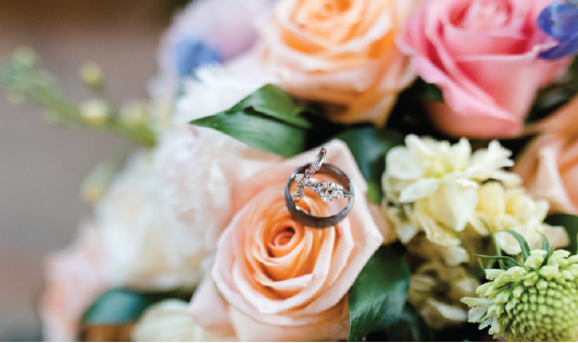 Bridal bouquet with rings of bride and groom. 