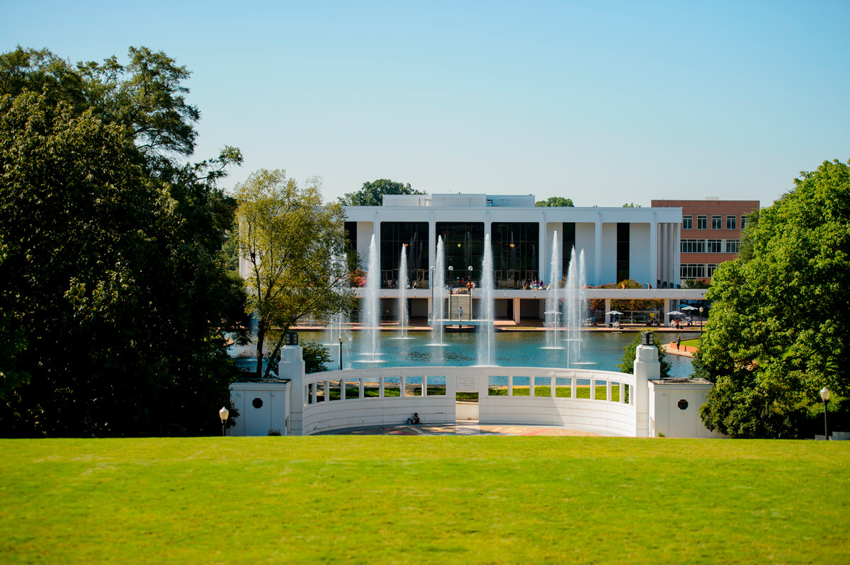 View from North Green facing the reflection pond fountains and Library