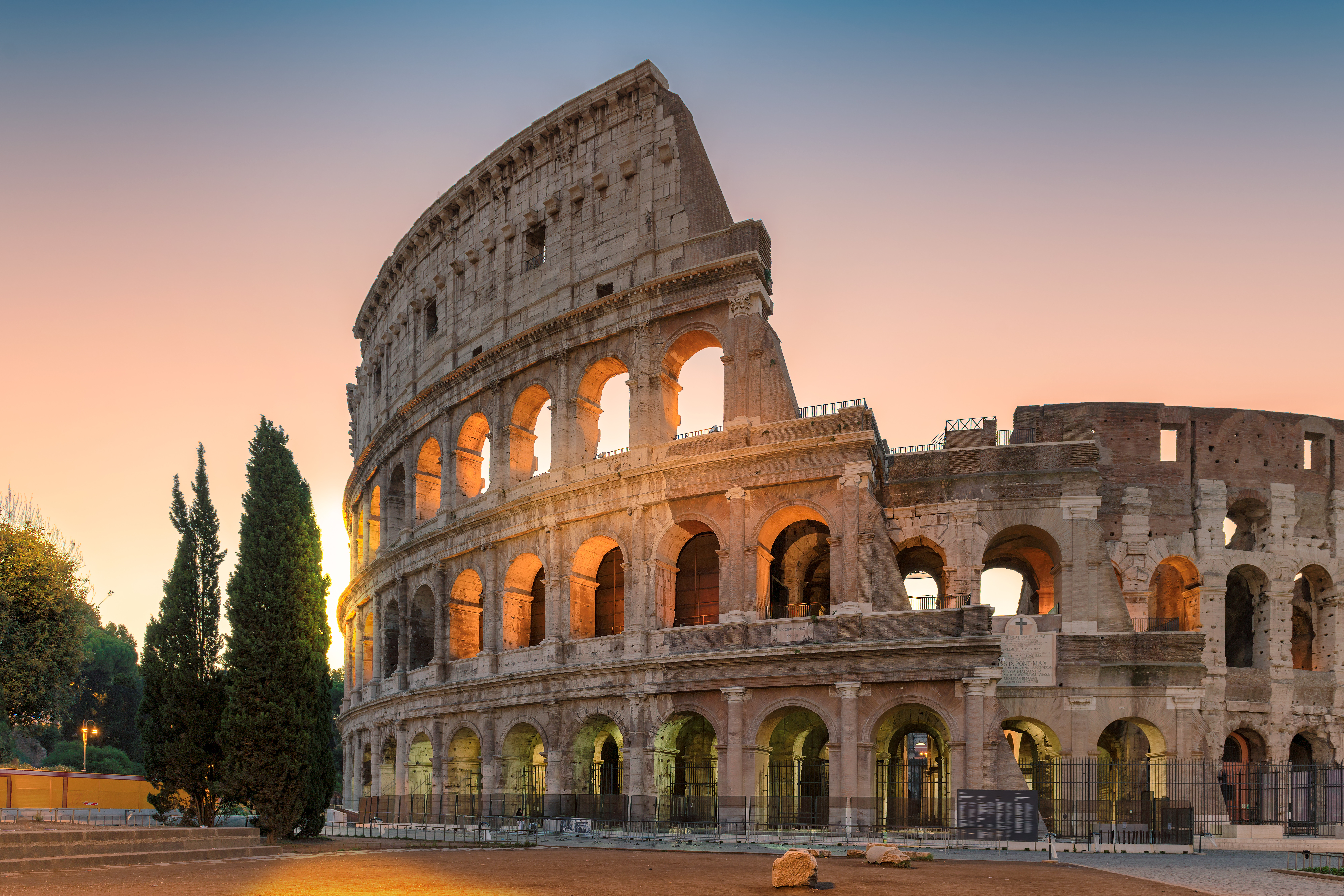 Roman Colosseum with sun setting behind