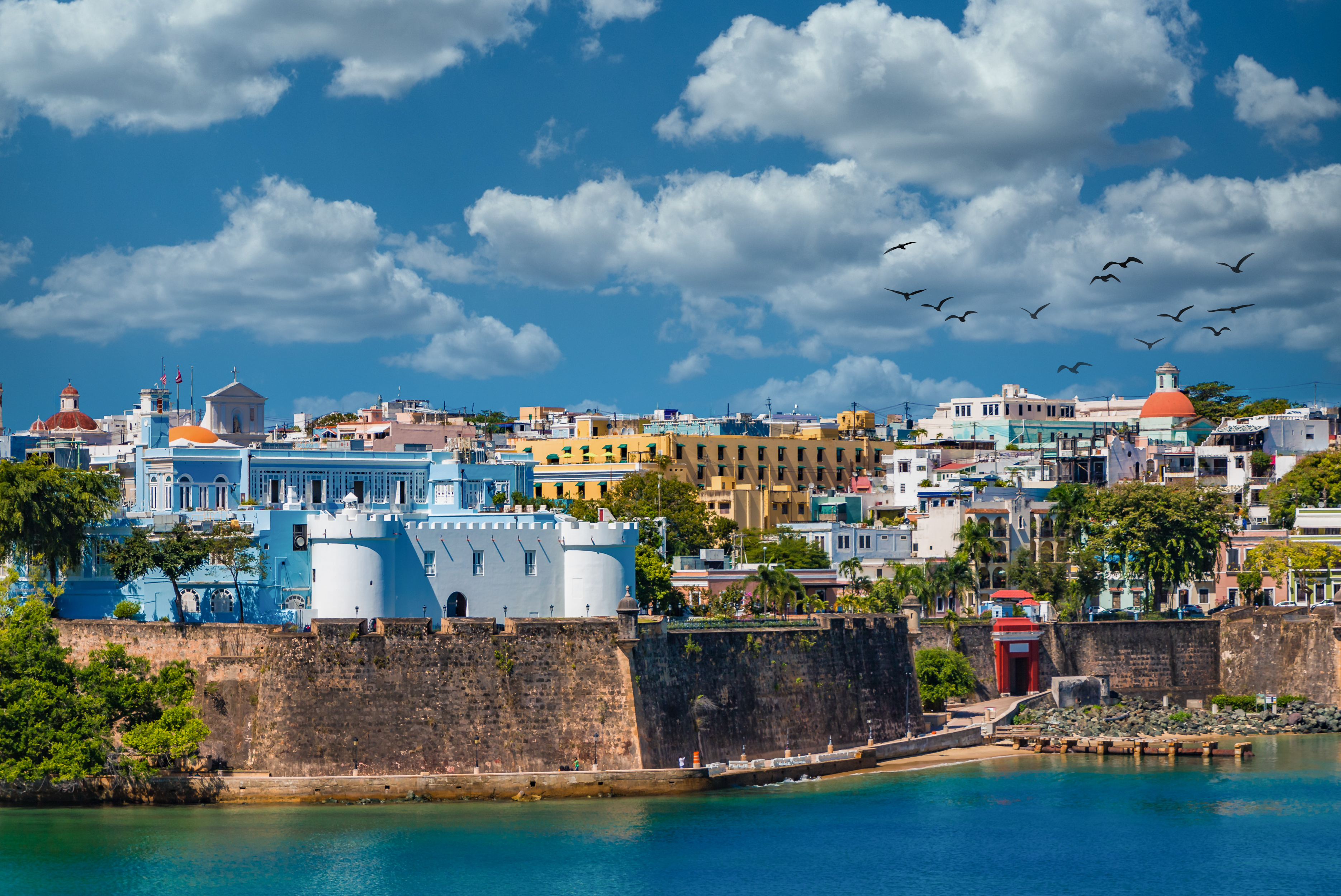 The city of San Juan with a view of the coast and small colorful buildings