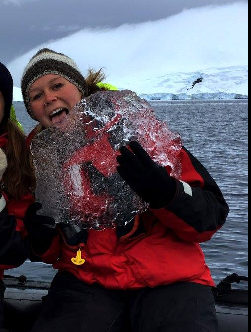 woman holding ice in Antartica